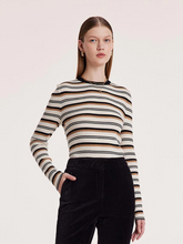 a lady in a machine washable wool striped sweater